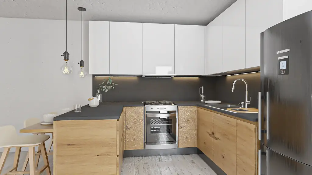 Cuisine en U – En teck, avec un plan de travail en granit.