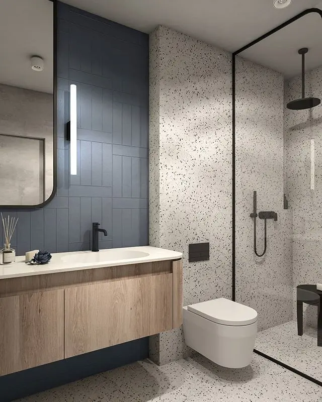Salle de bain moderne avec terrazzo et mur bleu texturé