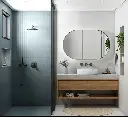 Salle de bain moderne avec douche bleu pastel et meuble flottant en bois